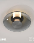 Ceiling light fixture with 'PURE' branding on a neutral background