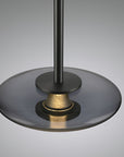 Close-up of a black and gold decorative light on a gray background