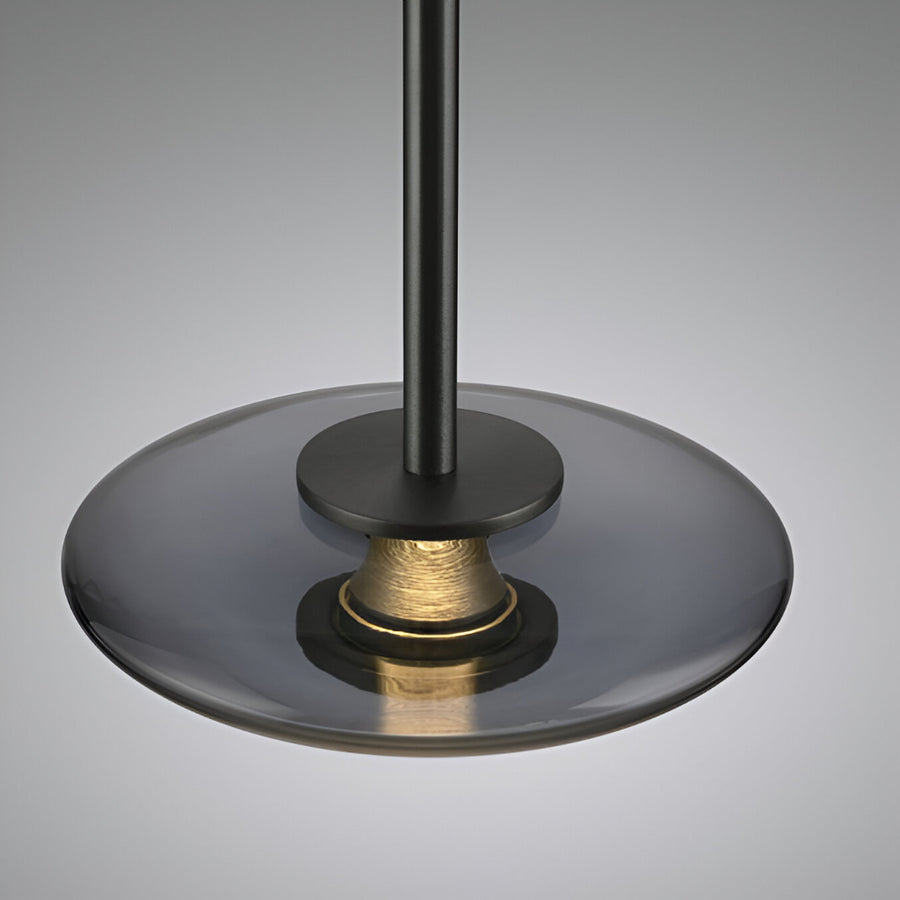 Close-up of a black and gold decorative light on a gray background