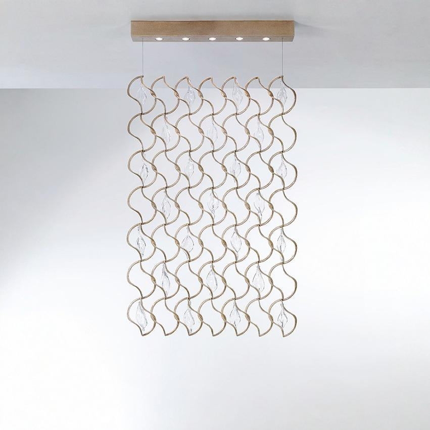 Decorative ceiling light fixture with wavy design on a white background