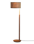 Floor lamp with wooden base and cylindrical brown shade on a white background from Nomon available at Spacio retail stores in Mumbai & Kolkata. 
