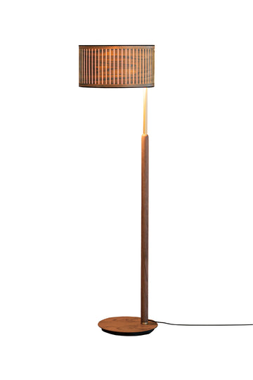 Floor lamp with wooden base and cylindrical brown shade on a white background from Nomon available at Spacio retail stores in Mumbai & Kolkata. 