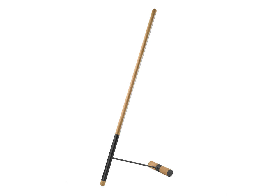 Oak wood & black metal detailing in a floor lamp from Nomon on a white background available at Spacio retail stores in Mumbai & Kolkata. 