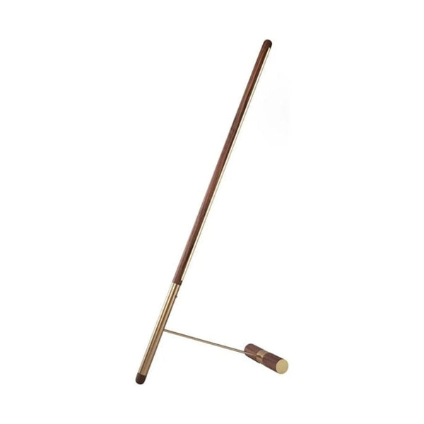 Brass & walnut wood floor lamp on a white background from Nomon available at Spacio retail stores in Mumbai & Kolkata. 