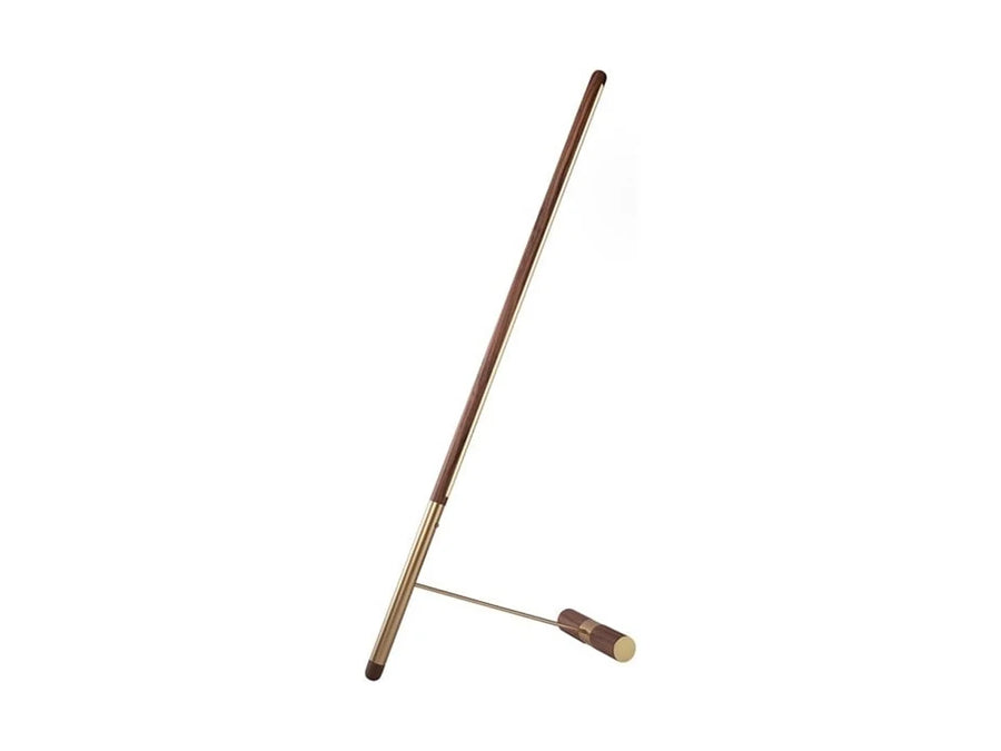 Brass & walnut wood floor lamp on a white background from Nomon available at Spacio retail stores in Mumbai & Kolkata. 