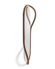Long, thin mirror with wooden frame on a white background