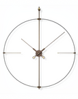 Large round wall clock with bronze metal design on a white background