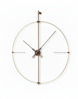 Decorative wall clock with bronze finish on a white background
