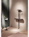 Modern wall-mounted wine rack with glasses in a stylish interior setting.