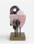 Decorative object with multicolored quartz on a white background