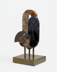 Decorative sculpture with natural stone elements on a white background