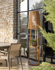 Wooden floor lamp cum side table in an outdoor setting with a stone wall and patio furniture  by Les Jardins available at Spacio retail stores in Mumbai & Kolkata. 