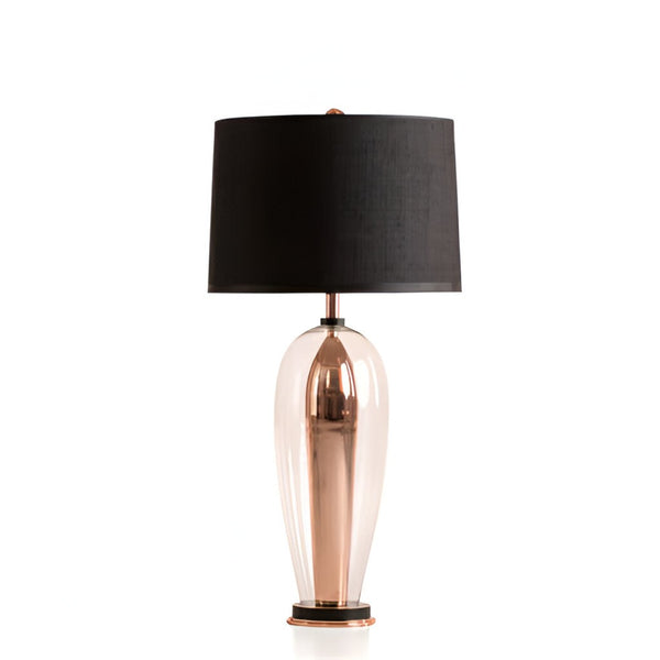 Table lamp with a black shade and copper base on a white background from Pieter Adam available at Spacio in India. 