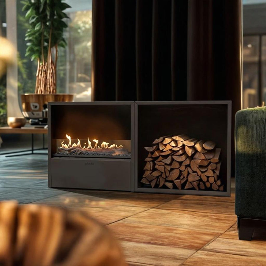 Modern fireplace with burning logs and stacked firewood in a cozy living room.