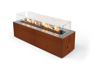 Rectangular gas fireplace in Corten steel  with flames on a white background from Planika available at Spacio in India. 