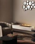 Modern living room with a fireplace, round mirror, and decorative items.