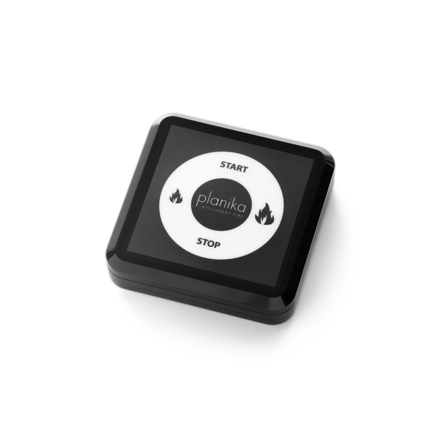 Black remote contorl with Planika branding on a white background