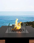 Outdoor fire pit table from Planika with ocean view available at Spacio retail stores in Mumbai & Kolkata. 