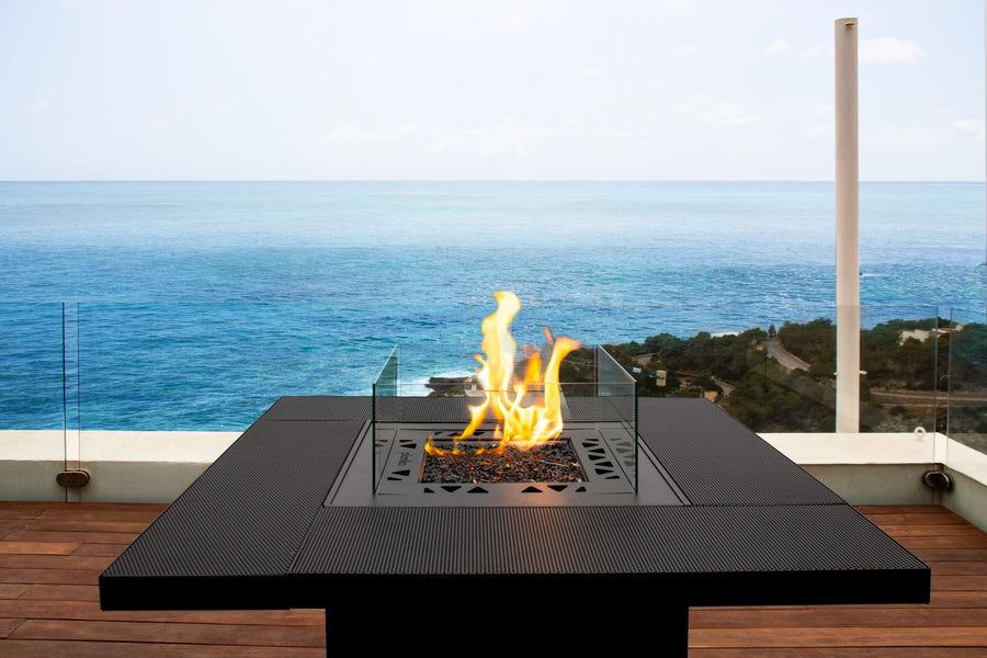 Outdoor fire pit table from Planika with ocean view available at Spacio retail stores in Mumbai & Kolkata. 