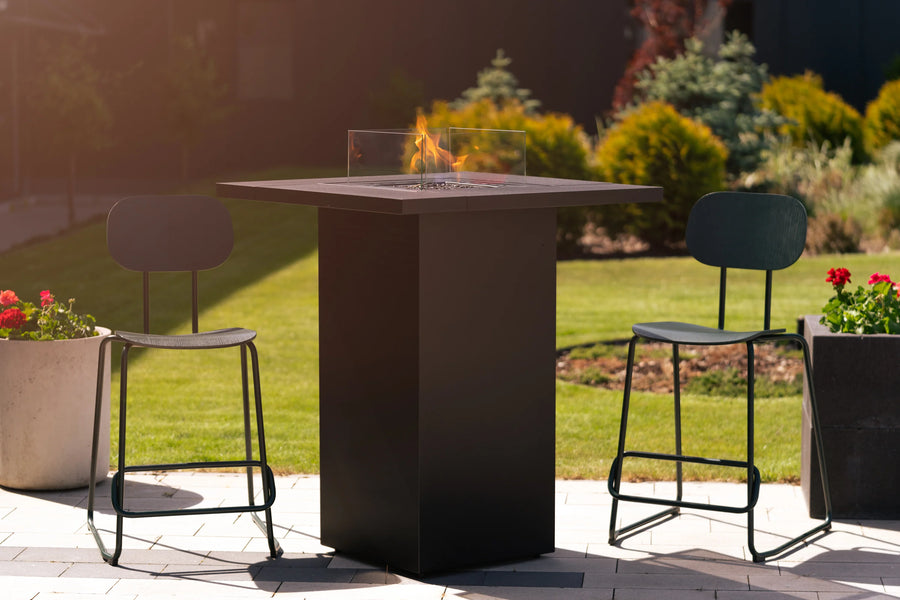 Outdoor gas fire table with chairs on a patio