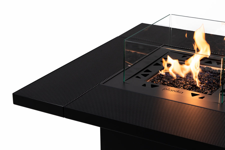 Close up of a gas fire pit table with flames on a white background from Planika available at Spacio retail stores in Mumbai & Kolkata. 
