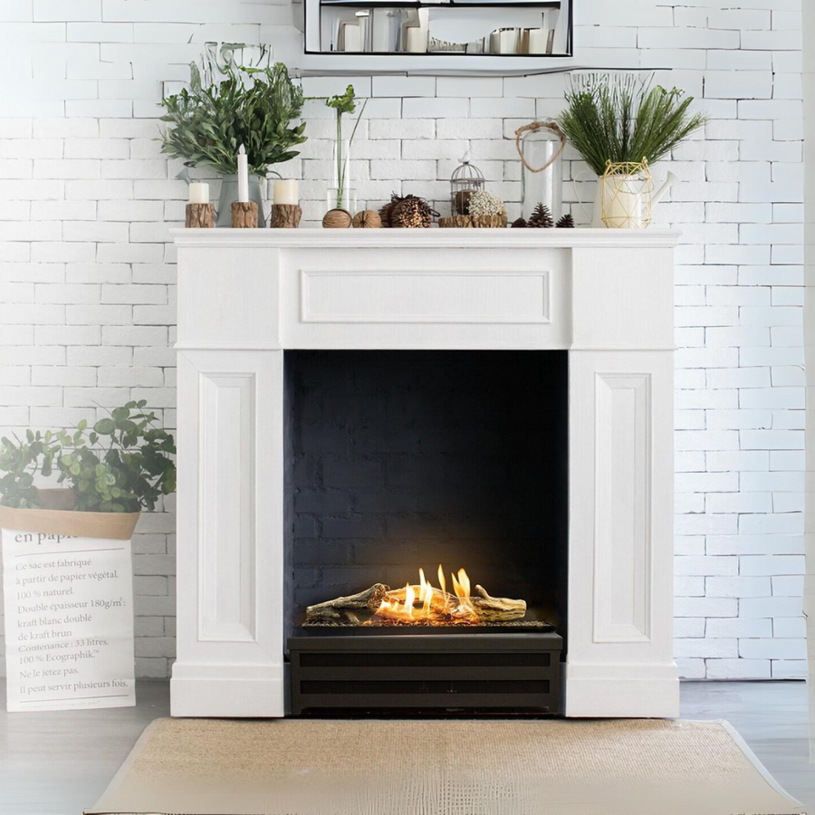 A fireplace with artificial logs from Planika inside a fireplace mantle. 