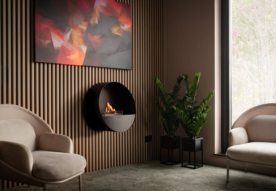 Modern living room with a wall-mounted fireplace, beige sofa, and abstract painting.