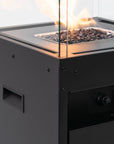 Close up of Planika's Faro outdoor gas fireplace with glass cover on a white background