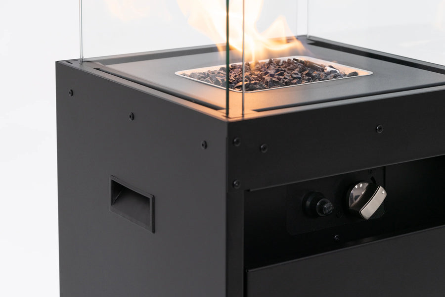 Close up of Planika's Faro outdoor gas fireplace with glass cover on a white background