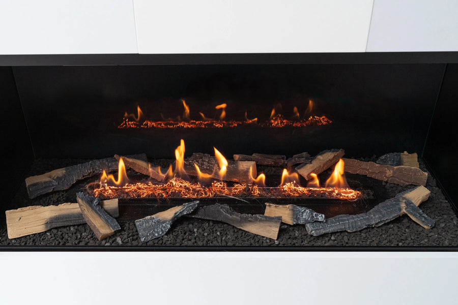 Modern bioethanol fireplace with glowing logs and flames on a black background