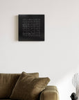 Qlocktwo Earth 45 Steel Black Pepper luxury Wall Clock in a modern living room interior available at Spacio India