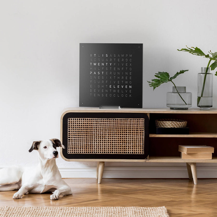 Qlocktwo Earth 45 Steel Black Pepper Clock on a wabi sabi style side board with decor accessories available at Spacio India from our Timepieces & Clocks collection