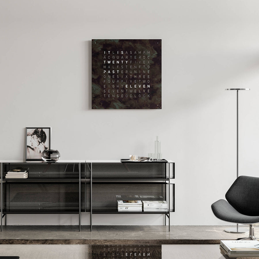 Qlocktwo Earth 90 Creator's Edition Raw Iron Limited Edition Clock on wall above modern console with decor accessories & furniture available at Spacio India for luxury home decor collection of Timepieces & Clocks.