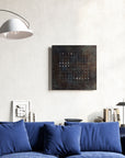 Qlocktwo Earth 90 Creator's Edition Raw Iron Limited Edition Clock in living room interior with Blue sofa & other home accessories available at Spacio India for luxury home decor collection of Timepieces & Clocks.