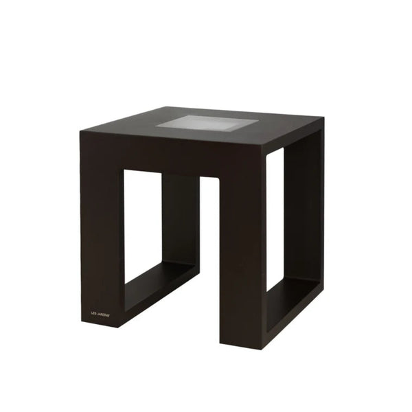Black solar light side table with glass top on a white background