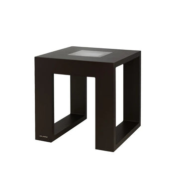 Black solar light side table with glass top on a white background