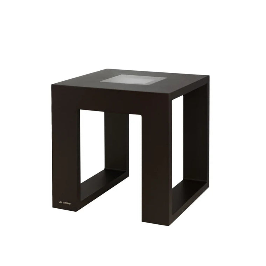 Black solar light side table with glass top on a white background