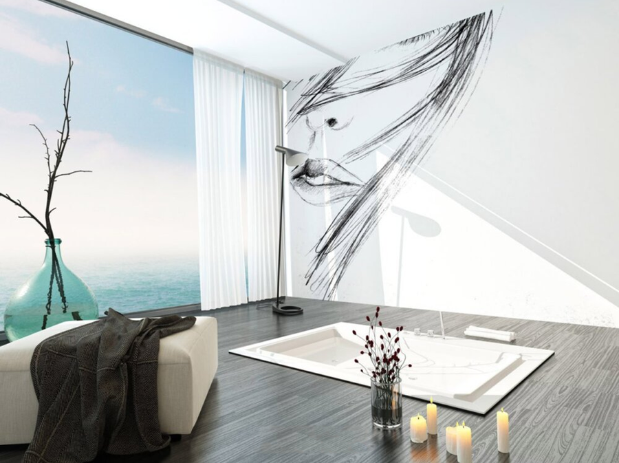 Charcoal sketch fresco mural featuring a detailed face with flowing lines, handcrafted on Italian plaster with Carrara marble and travertine. Featured on a wall in a living room next to sea