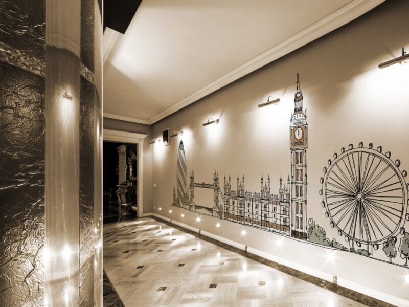 Watercolour sketch of London's skyline featuring Big Ben, Tower Bridge, The Gherkin, and the London Eye, handcrafted on an Italian fresco mural.. Featured in the entrance foyer of luxury mumbai high rise apartment styled by navin kanodia interior stylist of spacio mumbai