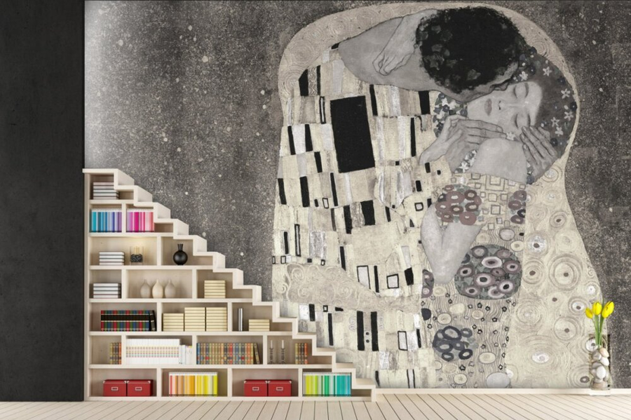 A fresco mural of Gustav Klimt’s The Kiss in subtle monochromatic tones, featuring an intricate blend of patterns and crafted with Italian plaster for a luxurious finish. Featured on a wall behind a wooden staircase book shelf