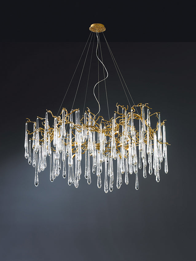 A Serip Aqua Chandelier with clear crystal drops inspired by nature, hanging from the ceiling.