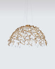 A Serip Aqua Chandelier, part of the Aqua Collection by Serip, with crystal drops hanging from it.