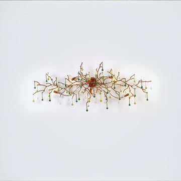A wall light with Glass shaped falling droplets of water hanging from gold colour branches