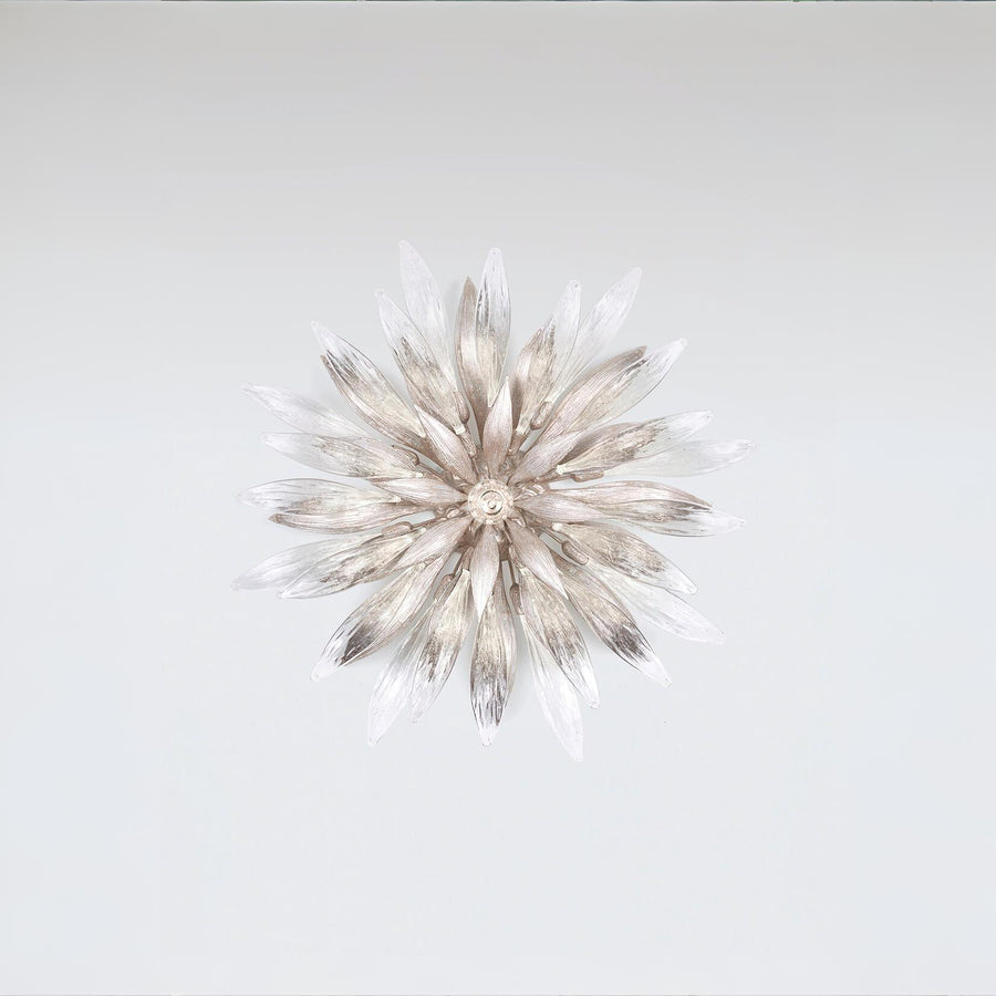 A decorative nature inspired flower shape light on a grey background