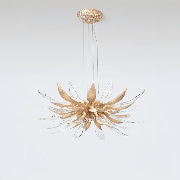 A flower shaped chandelier suspending from the ceiling on a light grey colour background. 