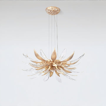 A flower shaped chandelier suspending from the ceiling on a light grey colour background. 