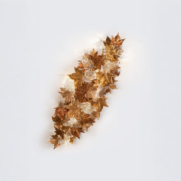 Decorative sculptural wall light on a white background