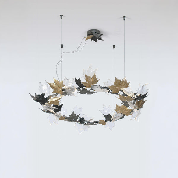 Decorative chandelier with leaf design on a white background