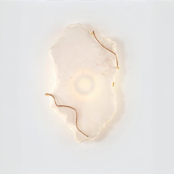 Decorative wall light with gold accents on a white background