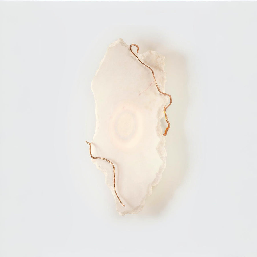 Decorative wall light fixture with a soft glow on a white background